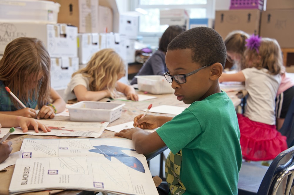 Young students writing at their desks