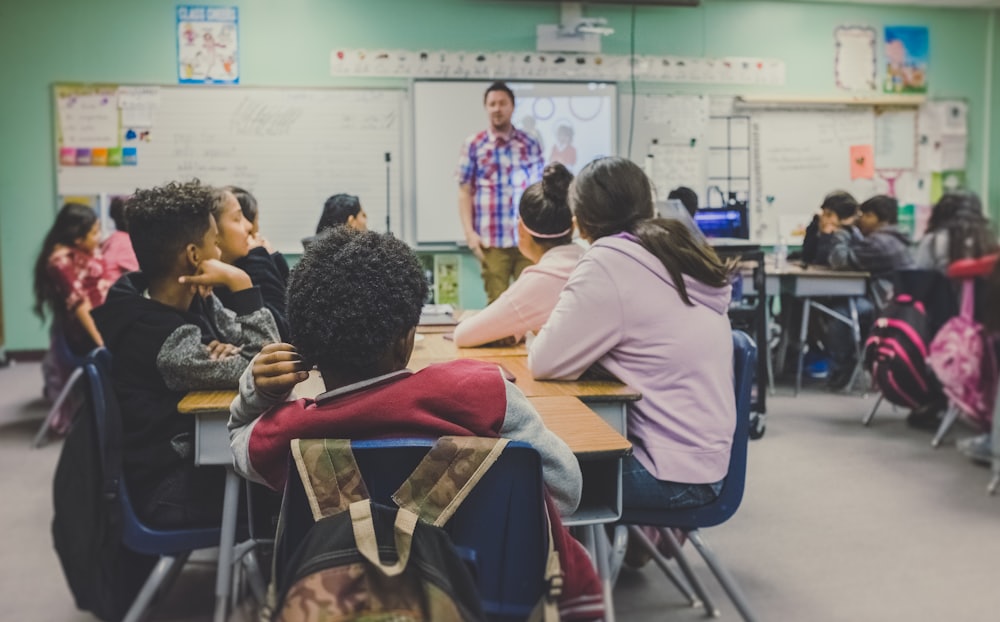 Teacher leading a classroom of students